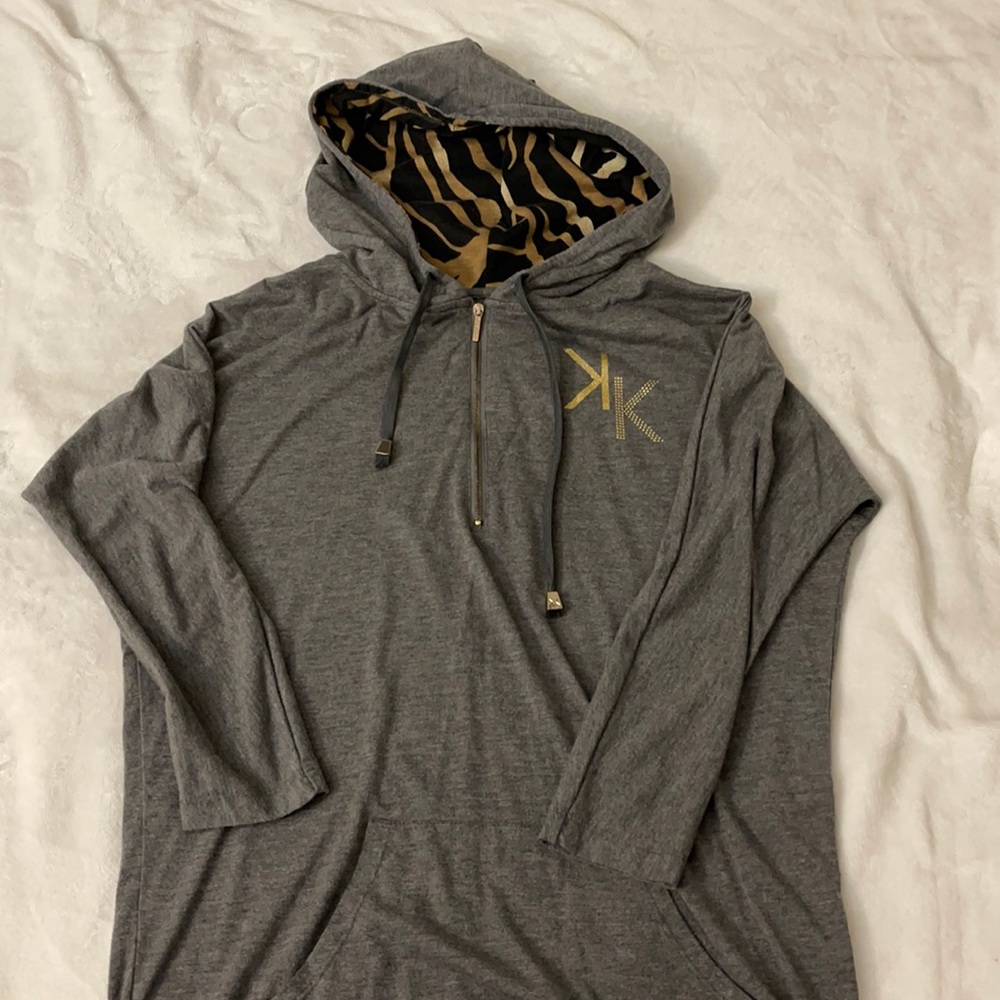 L/ Kardashian Kollection, hoodie type. Half sleeves. Kind of an animal print.